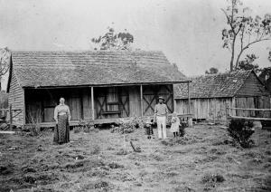 StateLibQld_1_51444_Family_in_front_of_their_farm_house,_ca._1900